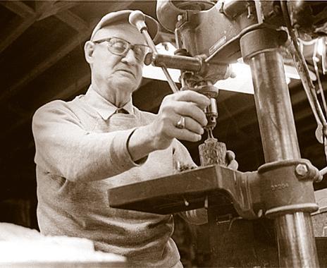 Tom Oats working machinery